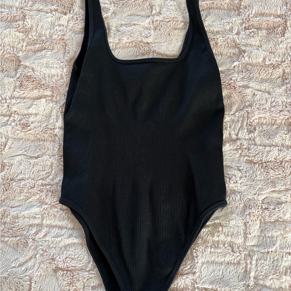 Black Ribbed One-Piece Bodysuit